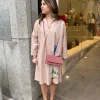 Jurk Cada nude met bloem | DELSCHER. Fashion